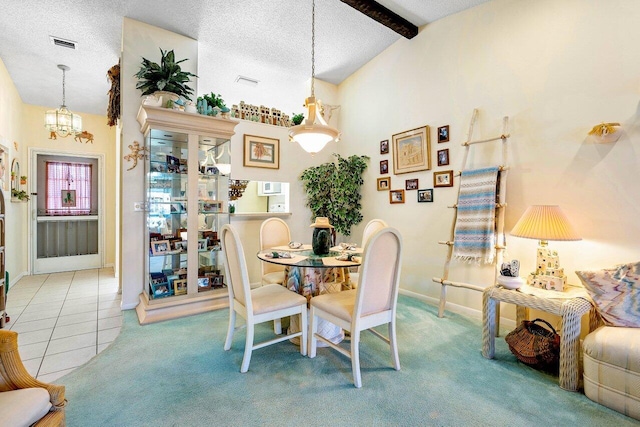 dining room with light carpet, vaulted ceiling with beams, a textured ceiling, and an inviting chandelier