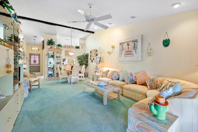 living room with ceiling fan, a textured ceiling, vaulted ceiling, and carpet