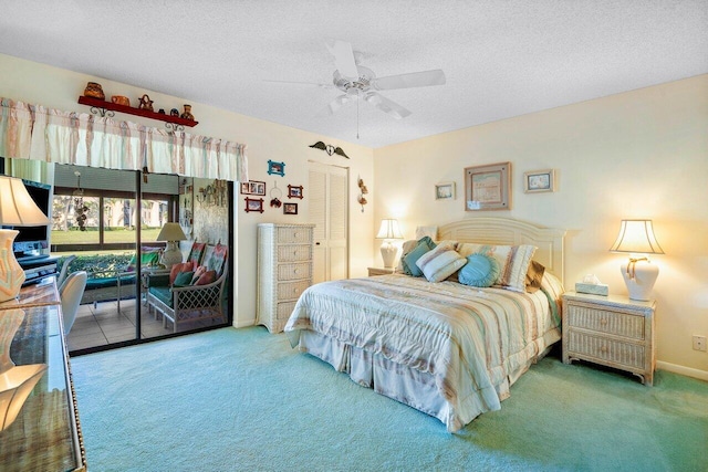 bedroom with a closet, ceiling fan, carpet flooring, and a textured ceiling