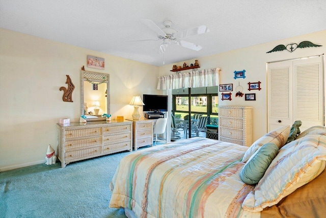 bedroom featuring access to exterior, a textured ceiling, a closet, carpet flooring, and ceiling fan