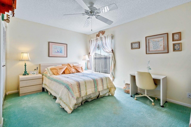 bedroom featuring ceiling fan, carpet floors, and a textured ceiling