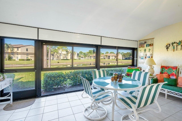 sunroom featuring lofted ceiling