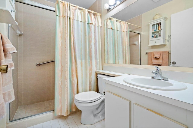 full bath with a shower stall, tile patterned floors, vanity, and toilet