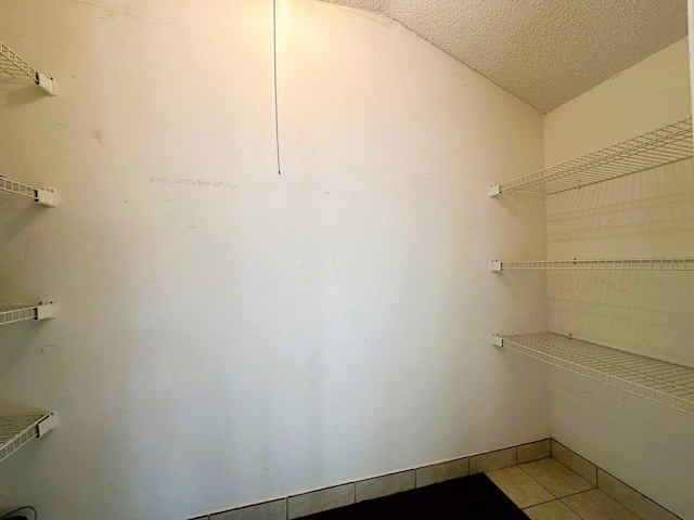walk in closet featuring light tile patterned floors