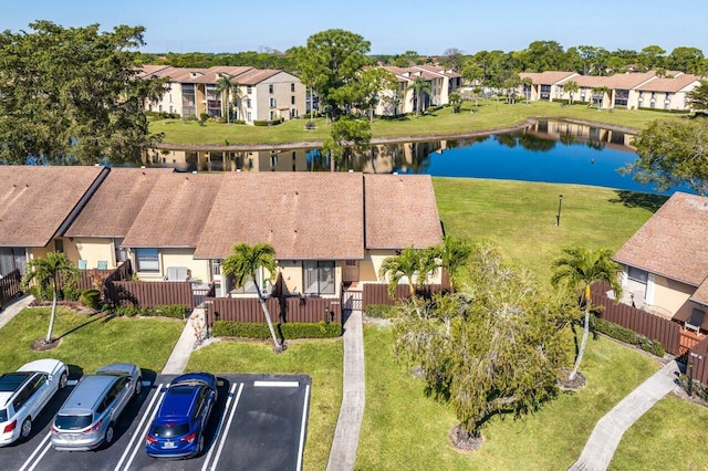 aerial view with a water view and a residential view