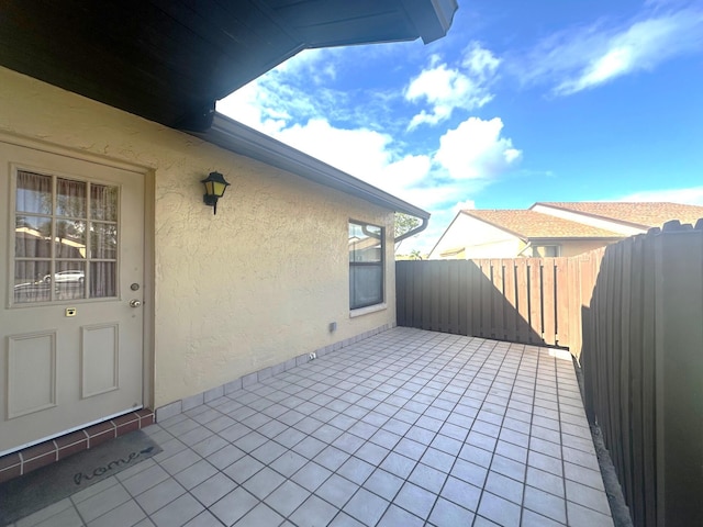 view of patio / terrace featuring fence