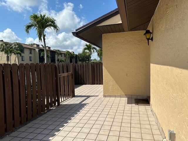 view of patio featuring fence