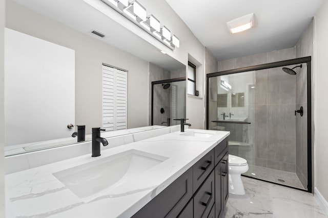 bathroom featuring walk in shower, vanity, and toilet