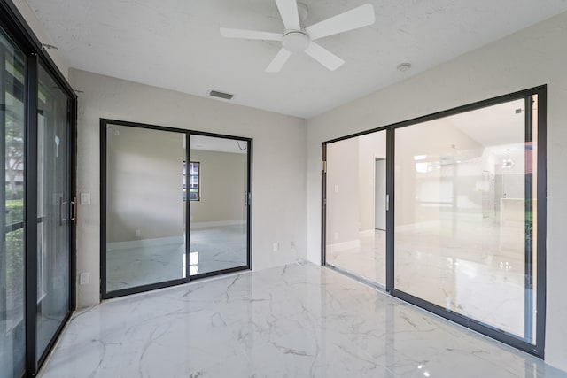 spare room with ceiling fan