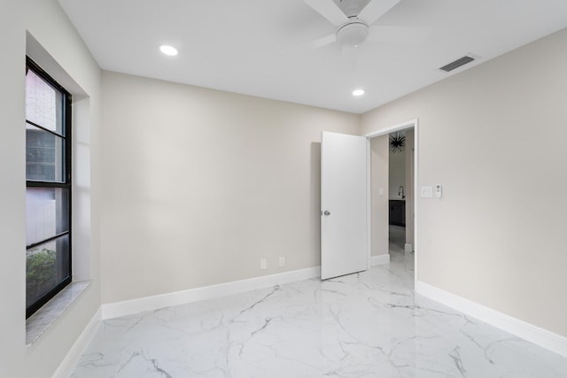 unfurnished room featuring ceiling fan