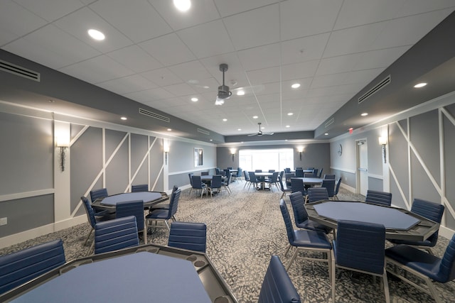 home theater featuring carpet floors, a drop ceiling, and ceiling fan