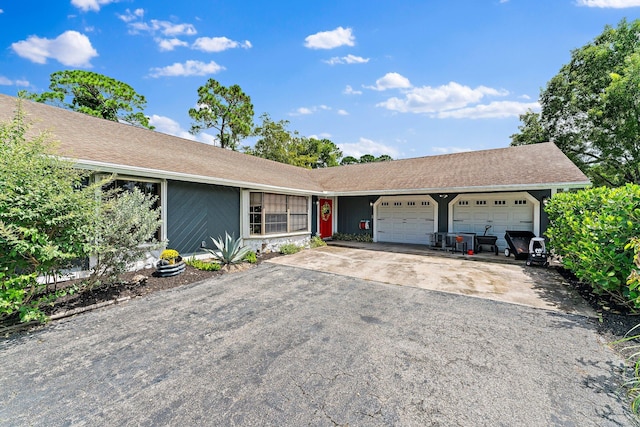 ranch-style house featuring a garage