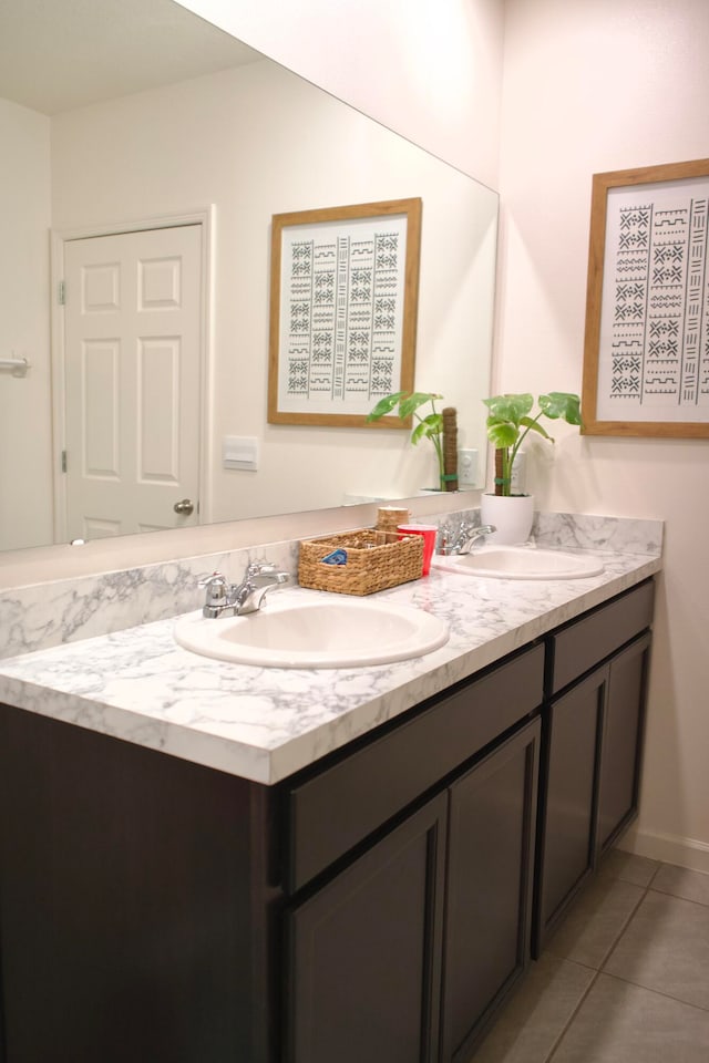 bathroom featuring tile patterned flooring and vanity