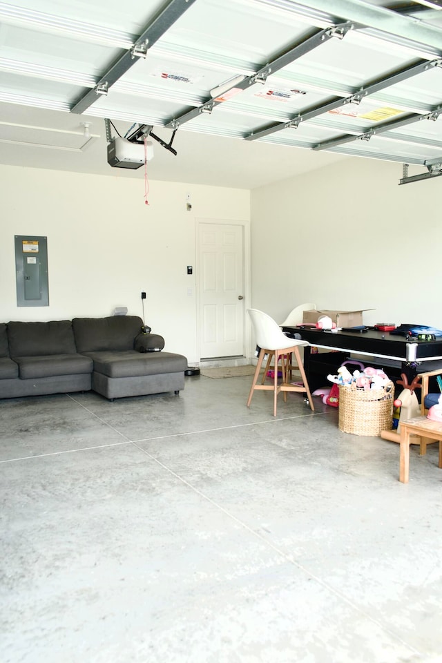 garage with electric panel and a garage door opener