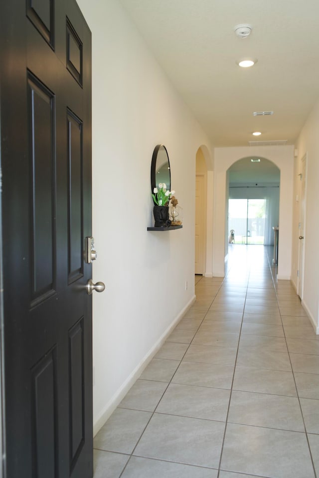 hallway featuring light tile patterned floors