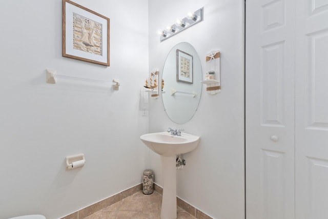 bathroom featuring tile patterned flooring and sink