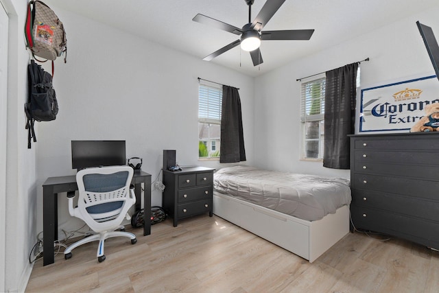 bedroom featuring light hardwood / wood-style floors and ceiling fan