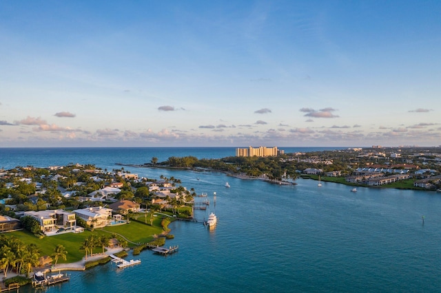 aerial view at dusk with a water view