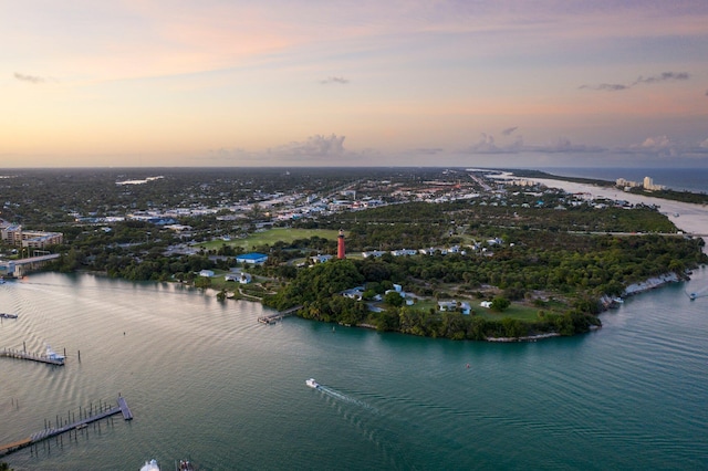 aerial view at dusk with a water view