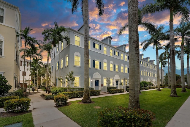 view of outdoor building at dusk