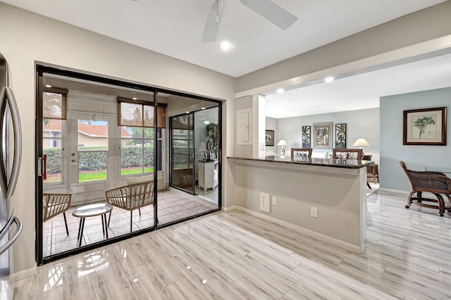 interior space with ceiling fan and light wood-type flooring