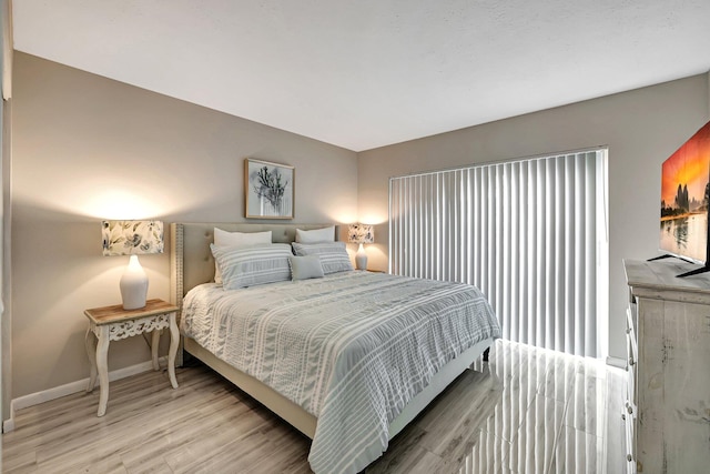 bedroom featuring wood-type flooring