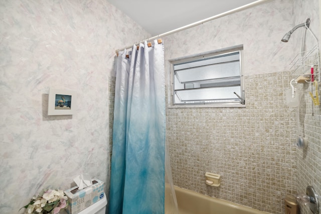 bathroom featuring shower / tub combo with curtain