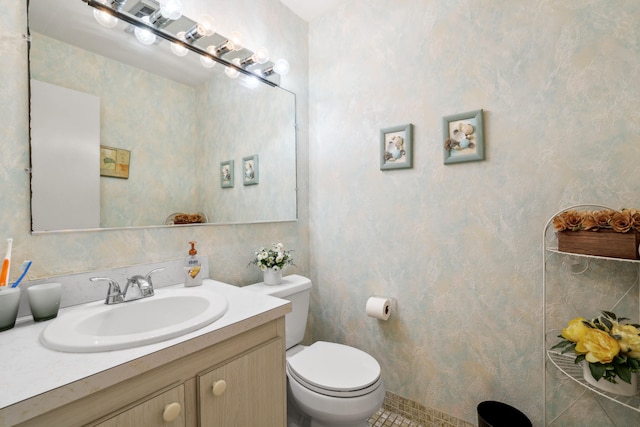 bathroom with vanity and toilet