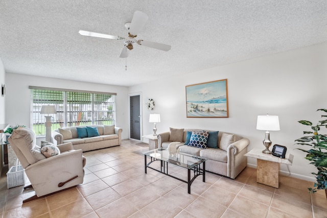 living room with light tile patterned floors, a textured ceiling, and ceiling fan