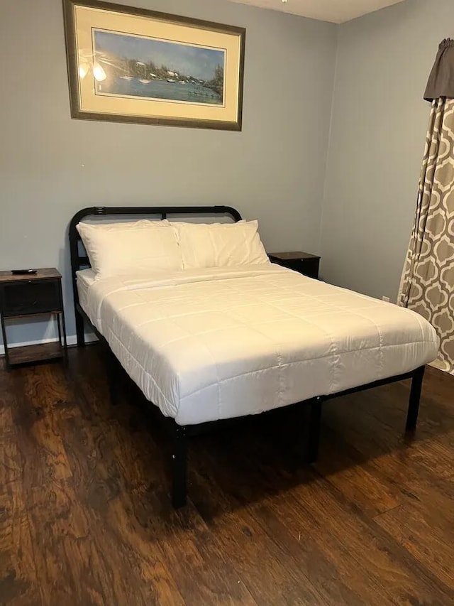 bedroom featuring dark hardwood / wood-style floors