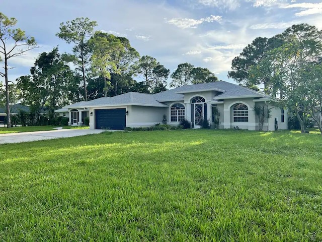 single story home with a front lawn and a garage