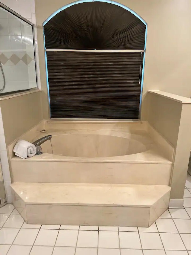 bathroom featuring independent shower and bath and tile patterned floors