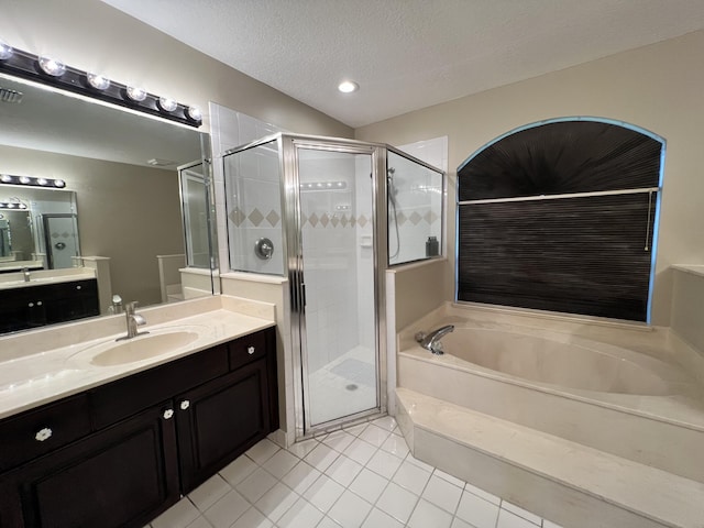 bathroom featuring independent shower and bath, vanity, and tile patterned floors