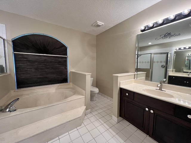 full bathroom with vanity, shower with separate bathtub, toilet, and a textured ceiling