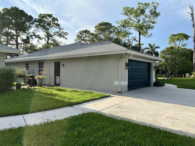 view of front of property with a garage and a front yard