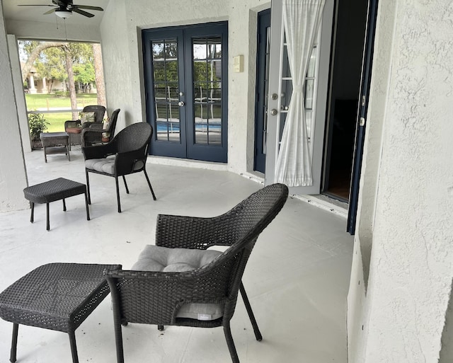 view of patio with ceiling fan and french doors