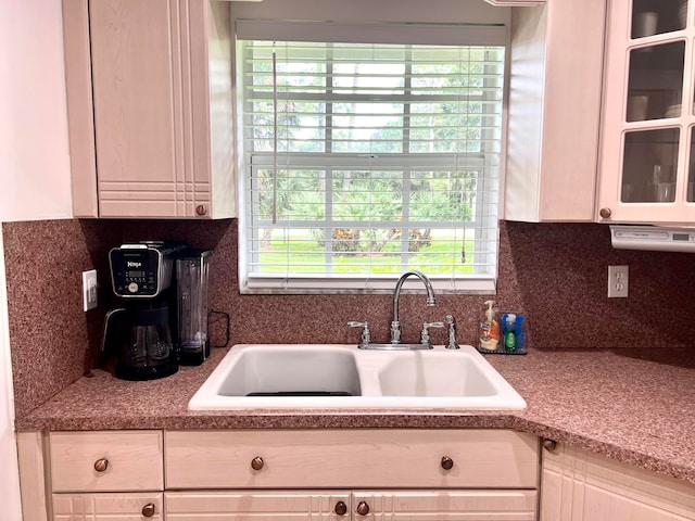 kitchen featuring decorative backsplash and sink