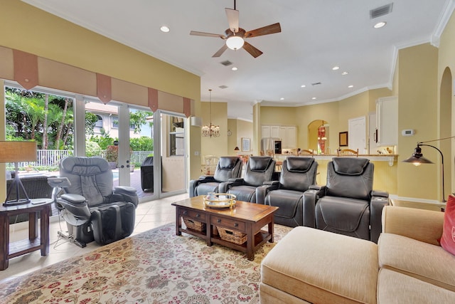 living room with ceiling fan with notable chandelier, light tile patterned flooring, and crown molding