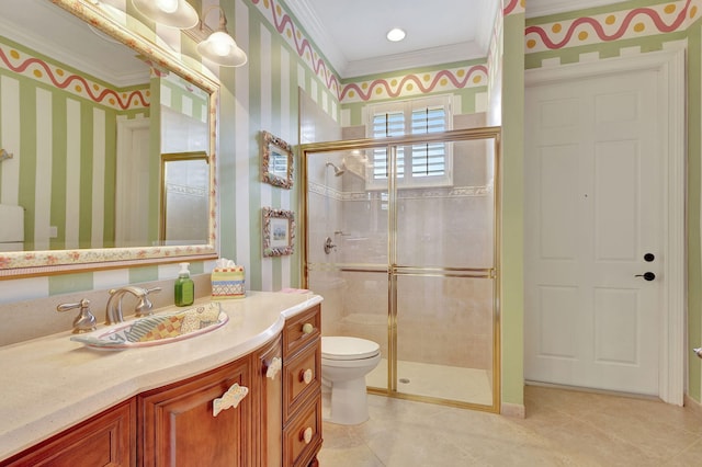 bathroom featuring crown molding, vanity, toilet, and an enclosed shower