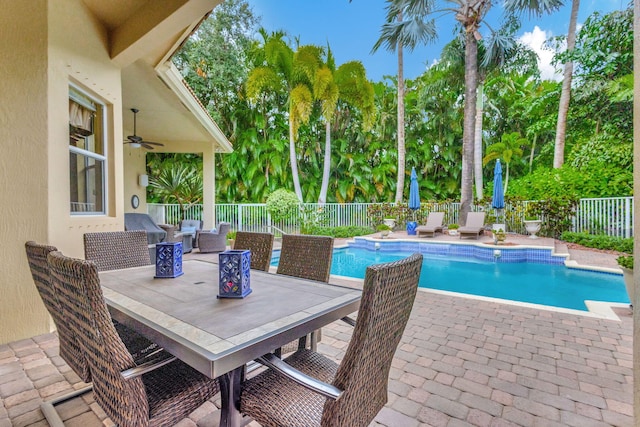 view of pool with a patio, ceiling fan, and outdoor lounge area