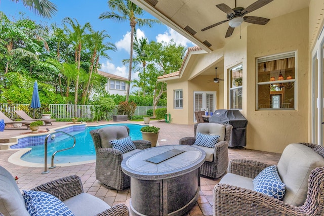 view of pool featuring a patio, grilling area, and ceiling fan