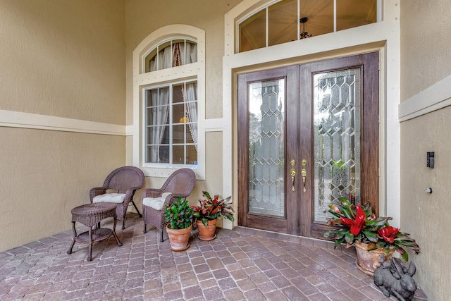 property entrance featuring french doors