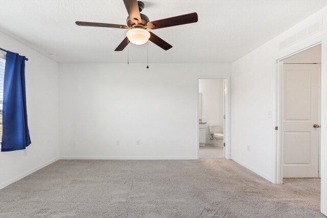 unfurnished room with ceiling fan and light colored carpet