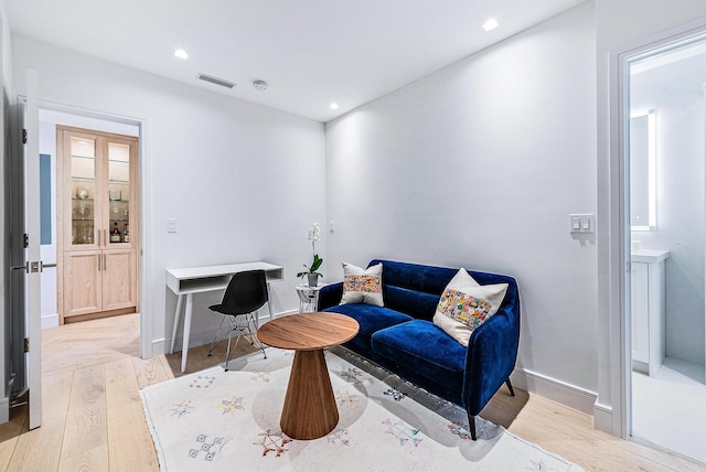 living area with light hardwood / wood-style flooring