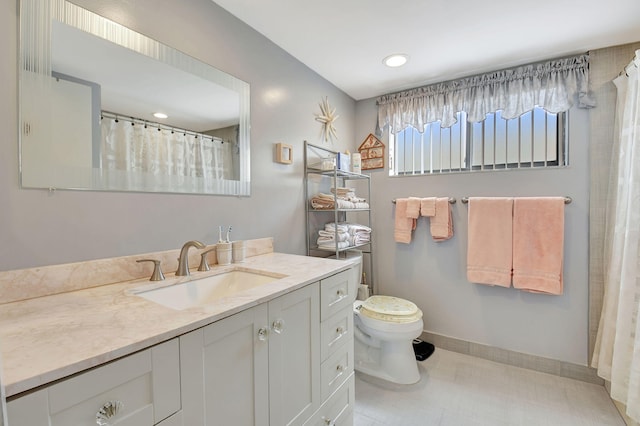 bathroom with recessed lighting, baseboards, toilet, and vanity