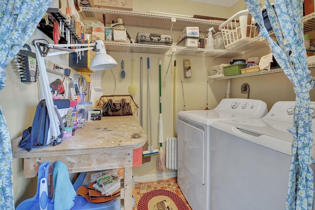 laundry room with washing machine and clothes dryer and laundry area