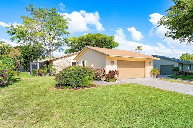 view of front facade with a garage and a front lawn