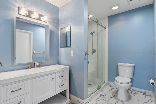 bathroom featuring vanity, toilet, and a shower with shower door