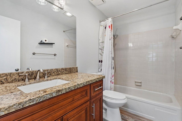 full bathroom featuring vanity, toilet, shower / bath combo with shower curtain, and hardwood / wood-style flooring