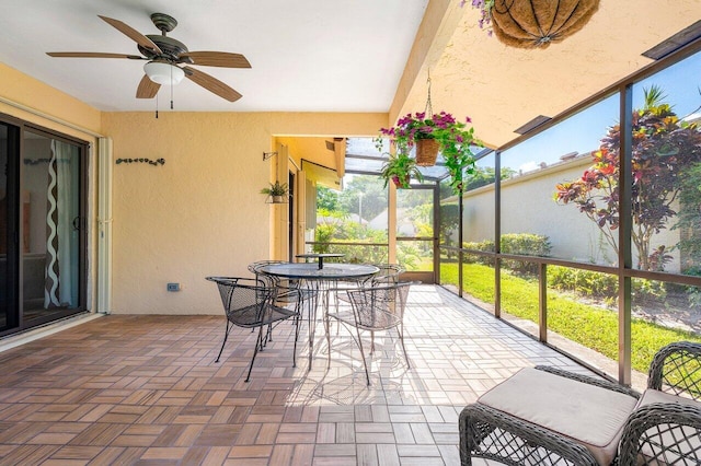 sunroom / solarium with ceiling fan and a wealth of natural light